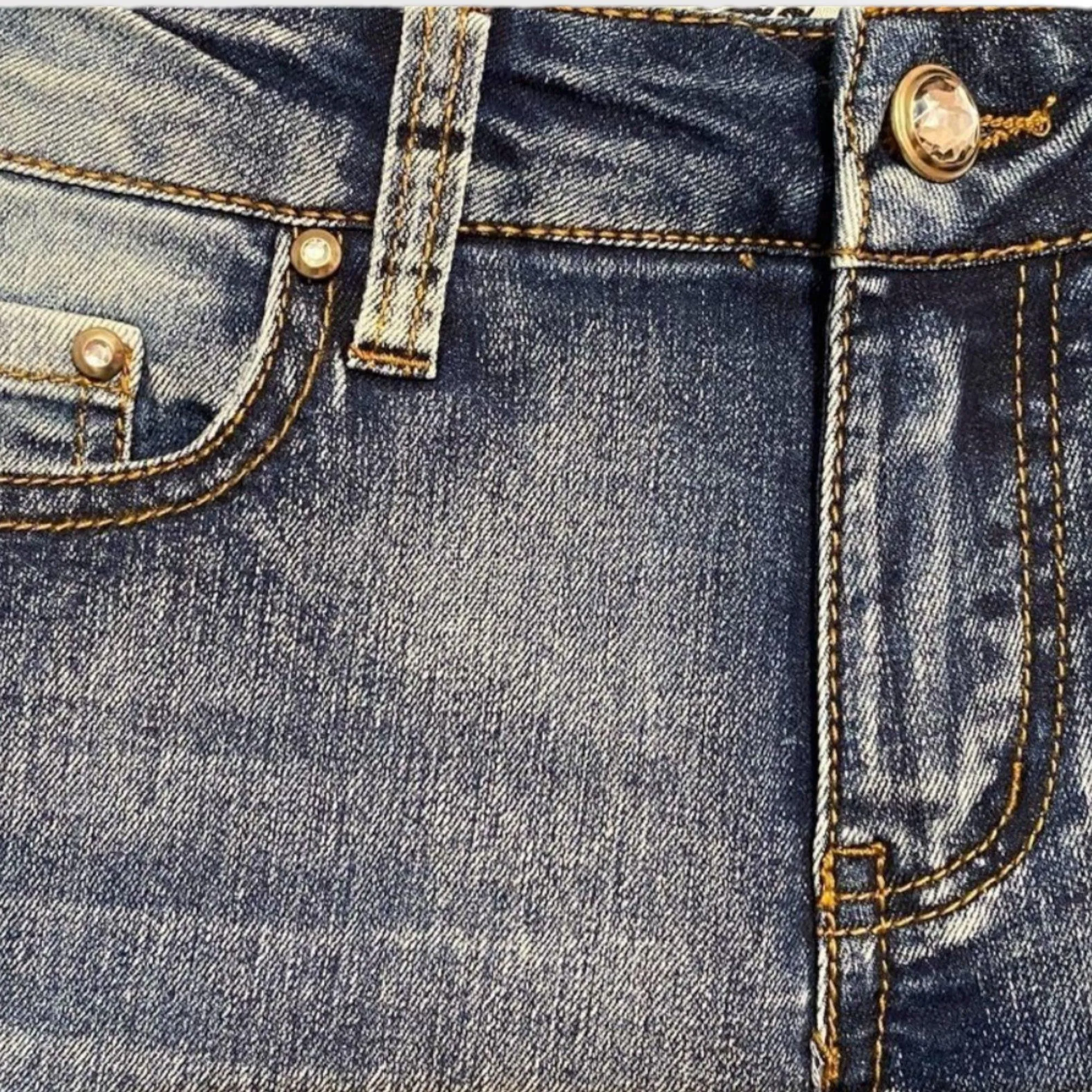 Mid Rise Distressed Denim Skinny Jeans
